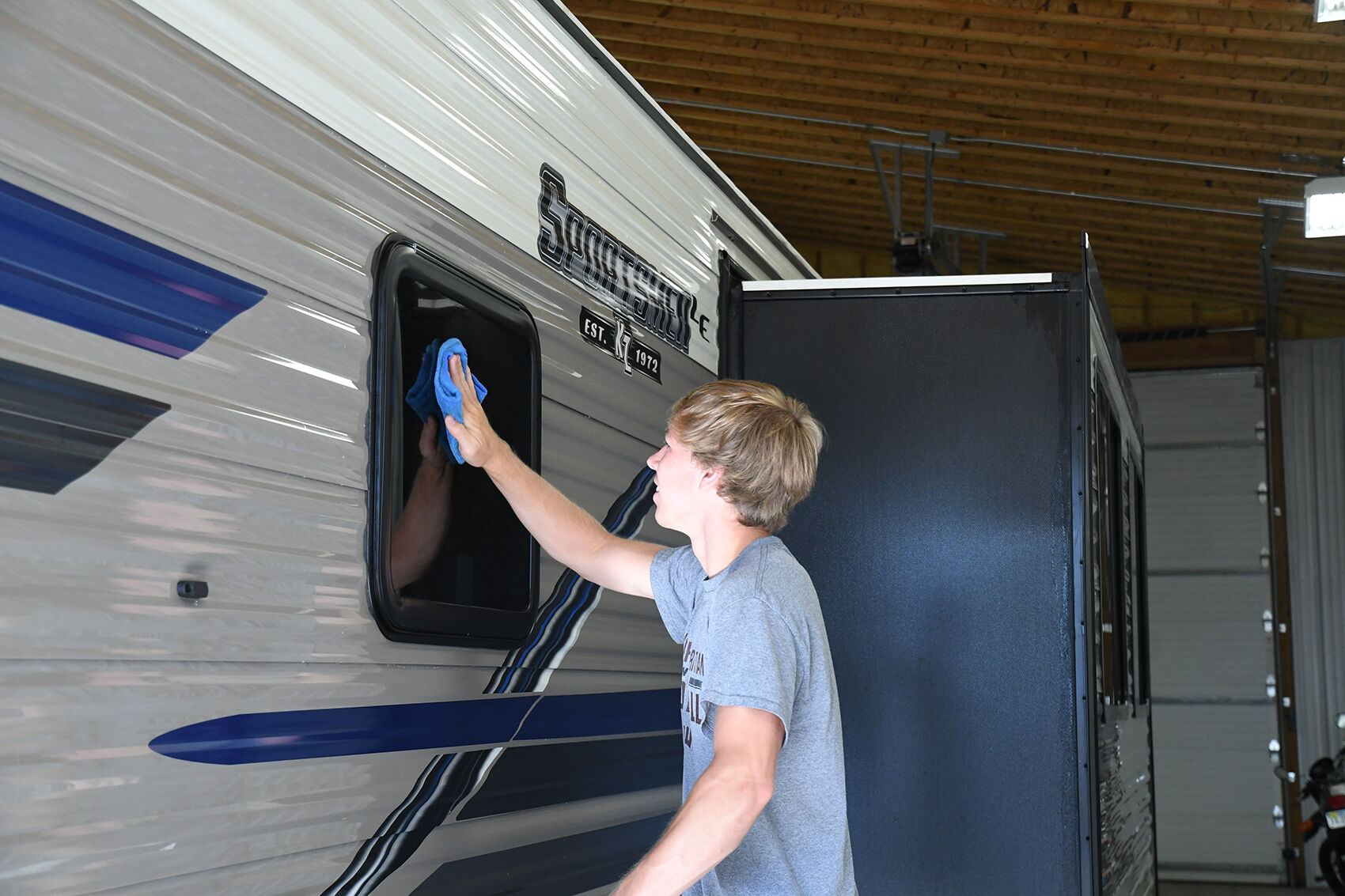 Evan Wibben polishes RV in Sheldon